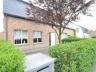 Woning in Ravels op 680m² Instapklare woning in rustige woonomgeving met buitenzwembad. Inkomhal met