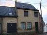 Ruime rijwoning met garage te Koekelare op 129 m². Met inkom, living, keuken, badkamer, zithoek, ber