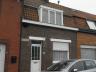 Rijwoning bestaande uit : inkom, voorplaats, living, ingerichte keuken, kelder, badkamer ligbad, toi