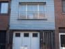 Rijwoning bestaande uit inkom, ruime living, keuken, badkamer met ligbad, 3 slpks, zolder, garage en