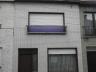 Rijwoning bestaande uit inkom, bureau, living, keuken, badkamer met ligbad, kelder, 2 slaapkamers (m