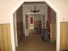 Rijwoning met tuin:  Gang met trap; voorplaats, middenplaats, keuken, badkamer met ligbad, lavabo, t