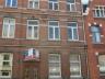 Centraal gelegen herenhuis     6 studioâ€™s en 1 appartement, als volgt: kelder met inkom achteraan 