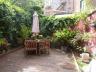Laat u charmeren door deze riante herenwoning met stadstuin, met behoud van authentieke elementen,  