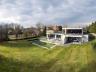 Deze designvilla met meer dan 500m² bewoonbare oppervlakte is gelegen in een rustige buurt aan het s